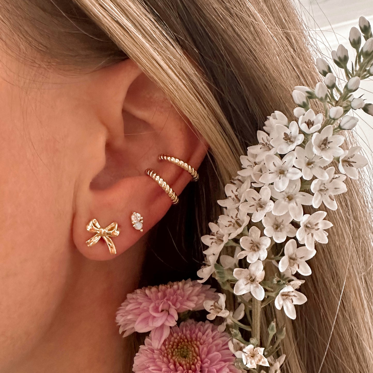 Golden bow studs